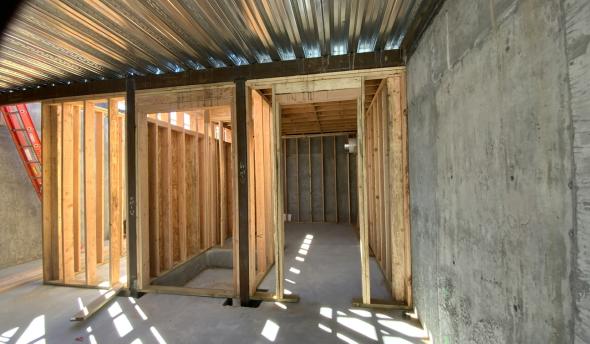 Erecting wood framing in basement at TNAH 2025