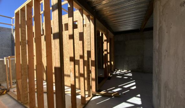 Erecting wood framing in basement at TNAH 2025